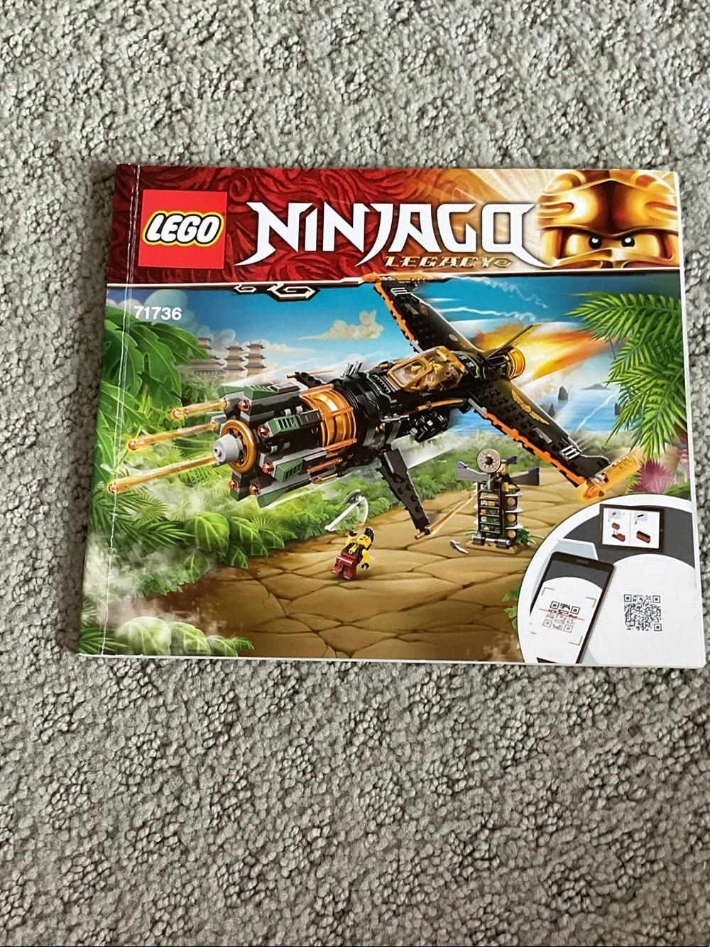 Lego black and orange jet fighter with green accents and minifigures
